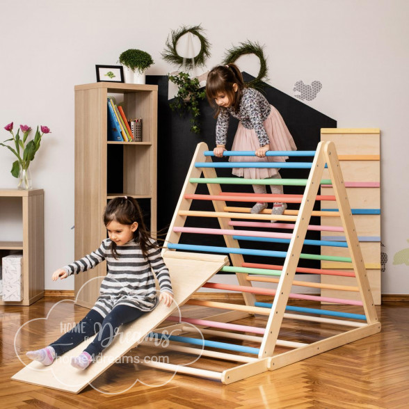 Children playing on a triangle climber toy with a slide