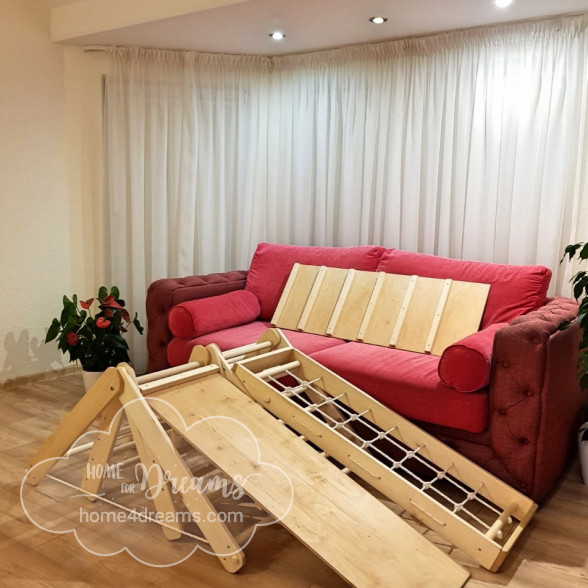 Children’s climbing toy with accessories in a living room