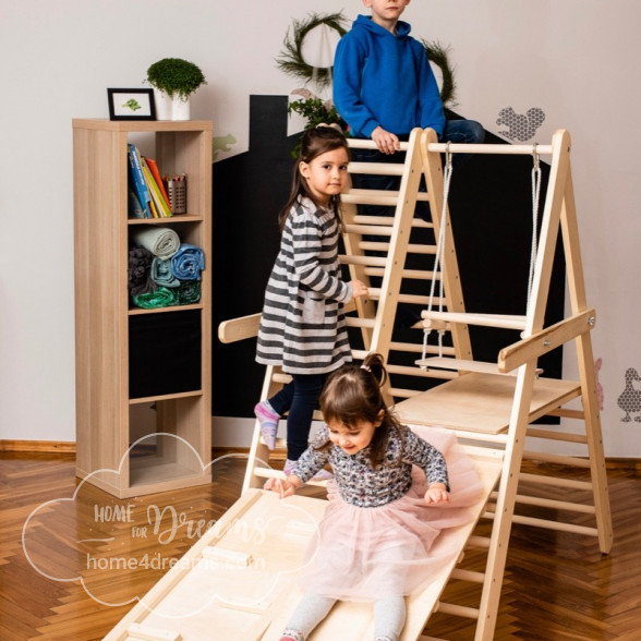 Children using a climbing triangle for toddlers with a slide board