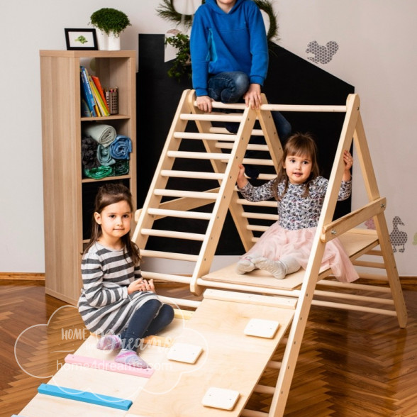 Pre-schoolers playing on a climbing ladder
