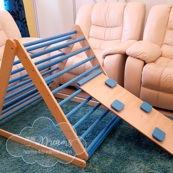 A modifiable baby climbing pikler triangle toy with a rock climbing board